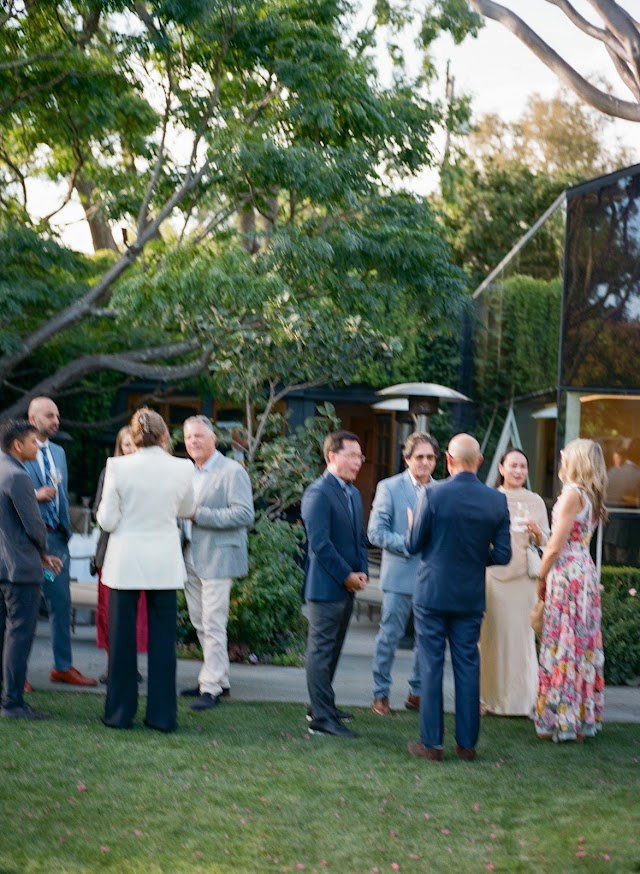 Small groups gathered across the lawn